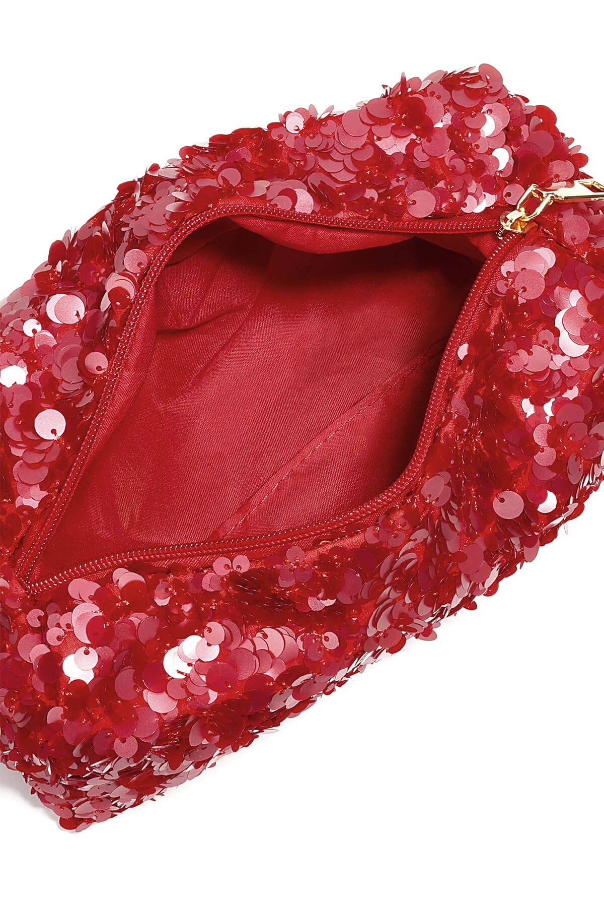 Binnenkant van rode make-up tas met pailletten