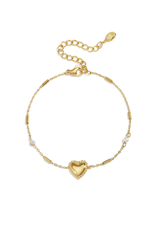 Minimalistische gouden stainless steel armband met statement hart