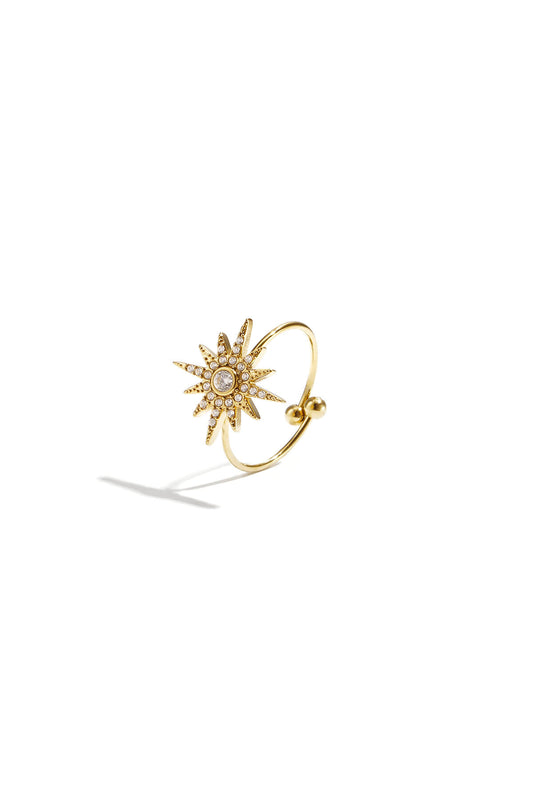 Verstelbare ring van stainless steel met vallende ster en steentjes in de kleur goud.