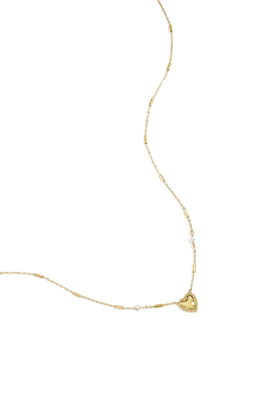 Gouden ketting met parels en statement hart